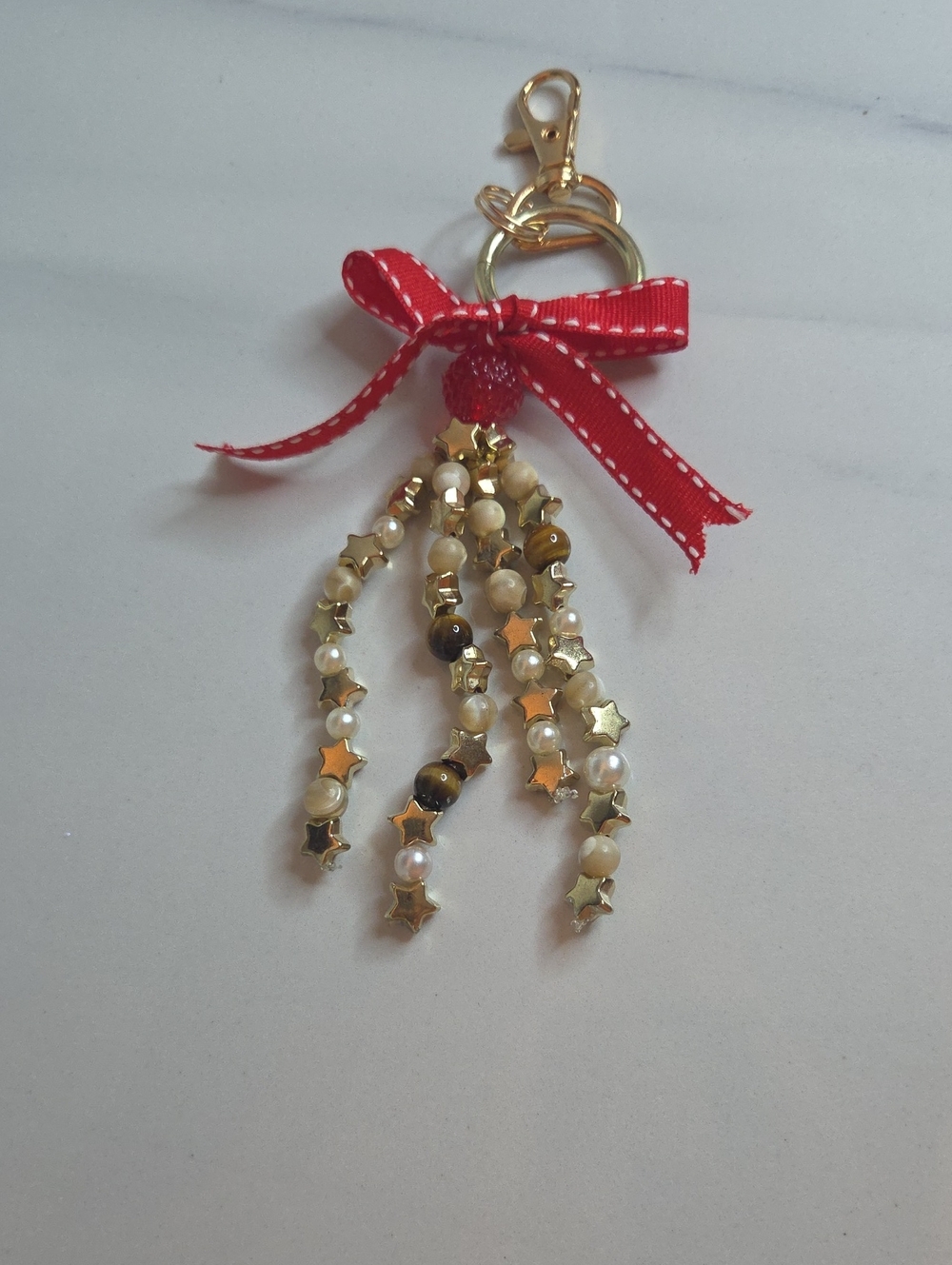 Gold Star Beaded Tassel Bag Charm with Red Ribbon